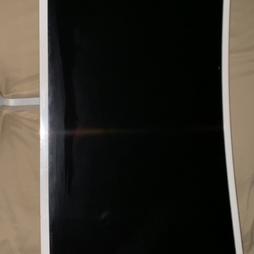 A Samsung monitor with a PS4 and and controller